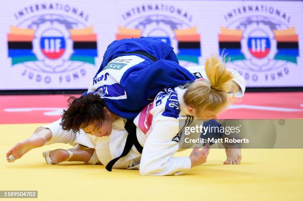 Kim Polling of Netherlands and Yoko Ono of Japan compete in the Women's -70kg Final on day two of the Judo Grand Slam at the Maruzen Intec Arena...