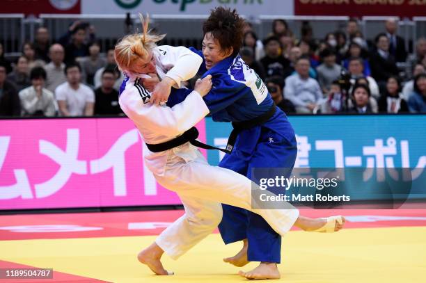 Kim Polling of Netherlands and Yoko Ono of Japan compete in the Women's -70kg Final on day two of the Judo Grand Slam at the Maruzen Intec Arena...