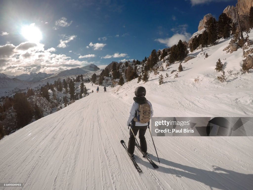 Skiers make their way thrugh Plan de Gralba on the Sella Ronda tour in the Dolomite SuperSki region