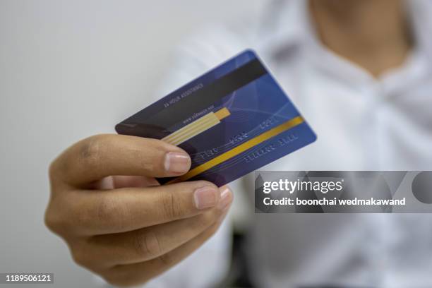 hand holding credit card - corporate business card stock pictures, royalty-free photos & images