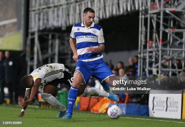 Llias Chair of Queens Park Rangers is challenged by Ivan Cavaleiro of Fulham during the Sky Bet Championship match between Fulham and Queens Park...