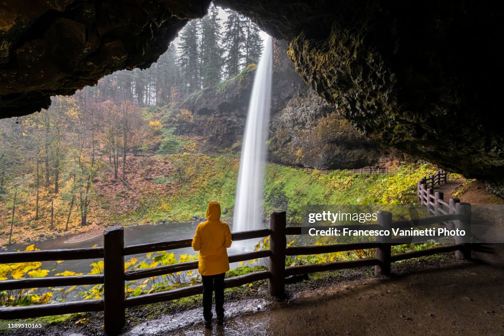 Woman visiting South Falls, Silver Falls State Park, Oregon, US.