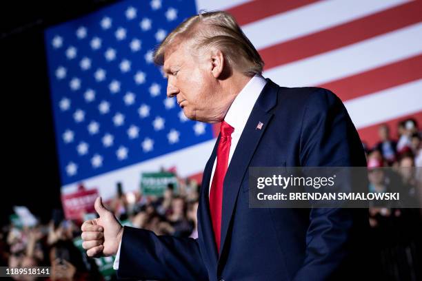 President Donald Trump gives a thumbs up during a Keep America Great Rally at Kellogg Arena December 18 in Battle Creek, Michigan.
