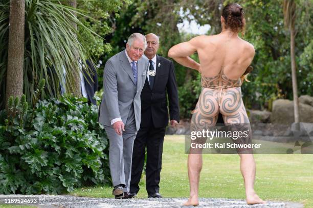 Maori warrior welcomes Prince Charles, Prince of Wales during a traditional welcome ceremony at Takahanga Marae on November 23, 2019 in Kaikoura, New...