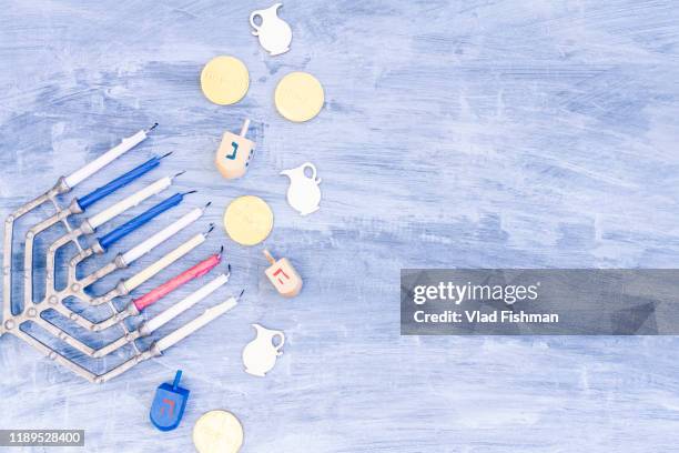 menorah, dreidels and hanukkah coins with copy space - dreidel stock pictures, royalty-free photos & images