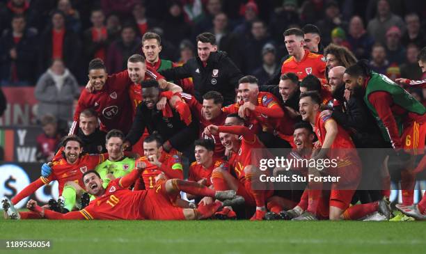 Wales player Aaron Ramsey joins in the celebrations with his team mates after the UEFA Euro 2020 qualifier between Wales and Hungary at Cardiff City...