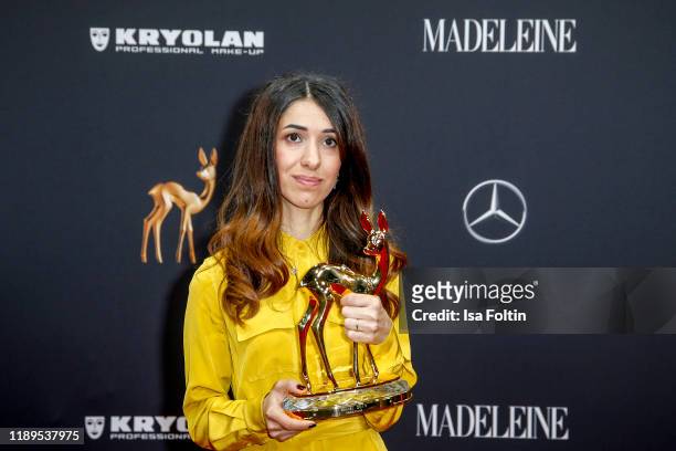 Award winner Nadia Murad poses with award during the 71st Bambi Awards winners board at Festspielhaus Baden-Baden on November 21, 2019 in...