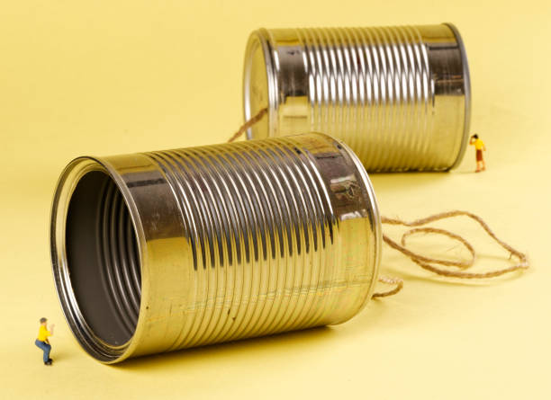 tin can phone - people talking with cans on string stock pictures, royalty-free photos & images