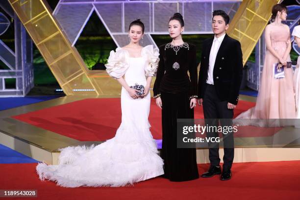 Actress Cecilia Liu Shishi, actress Ni Ni and actor Darren Wang Talu attend the closing ceremony of the 28th China Golden Rooster And Hundred Flowers...