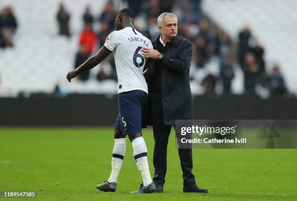 Jose Mourinho, Manager of Tottenham Hotspur embraces Davinson Sanchez of Tottenham Hotspur after the Premier League match between West Ham United and...