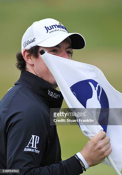 Rory McIlroy of Northern Ireland waits on a green during the final practice round during The Open Championship at Royal St. George's on July 13, 2011...