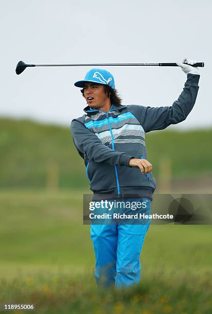 Rickie Fowler of the USA watches a shot during the final practice round during The Open Championship at Royal St. George's on July 13, 2011 in...