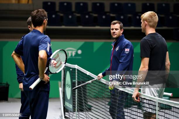 Great Britain captain Leon Smith talks with Kyle Edmund of Great Britain and coaches Nick Weal and Colin Beecher in a training session during Day Six...