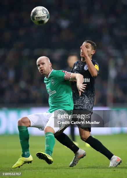 Davy Klaassen of SV Werder Bremen battles for possession with Amine Harit of FC Schalke 04 during the Bundesliga match between SV Werder Bremen and...