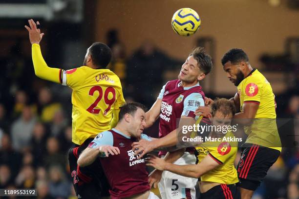 Etienne Capoue of Watford, during Ashley Barnes, James Tarkowski of Burnley, Craig Dawson and Adrian Mariappa of Watford jump for the ball during the...