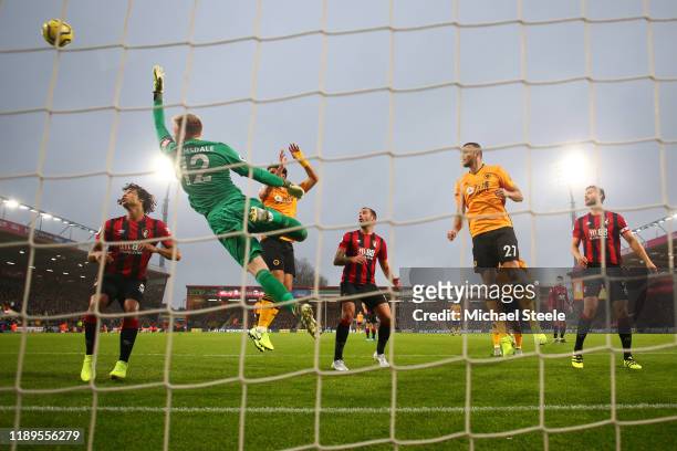 Aaron Ramsdale of AFC Bournemouth fails to save a free-kick from Joao Moutinho of Wolverhampton Wanderers which results in their first goal during...