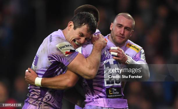 Chiefs player Henry Slade is congratulatedd by Ian Whitten and Stuart Hogg after scoring the second Chiefs try during the Heineken Champions Cup...