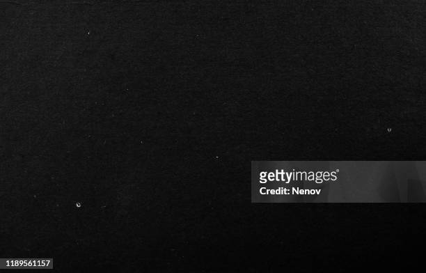 close-up of black cardboard paper texture background - colore nero foto e immagini stock