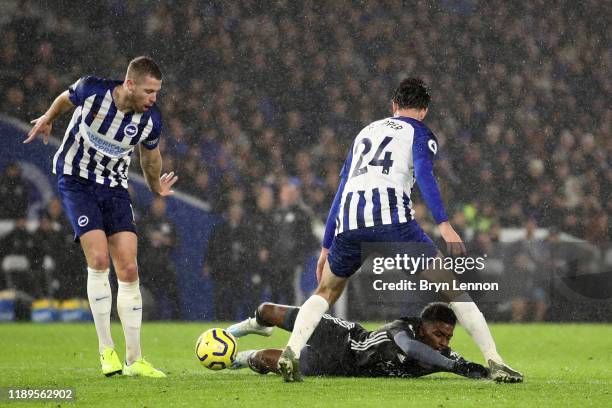 Demarai Gray of Leicester City is fouled by Davy Propper of Brighton and Hove Albion during the Premier League match between Brighton & Hove Albion...