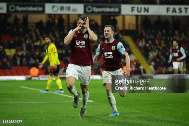 James Tarkowski of Burnley celebrates with teammate Ashley Barnes after scoring his team's third goal during the Premier League match between Watford...