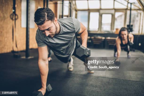 personal weight training in the gym - press ups stock pictures, royalty-free photos & images