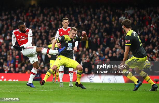 Alexandre Lacazette of Arsenal scores their first goal during the Premier League match between Arsenal FC and Southampton FC at Emirates Stadium on...
