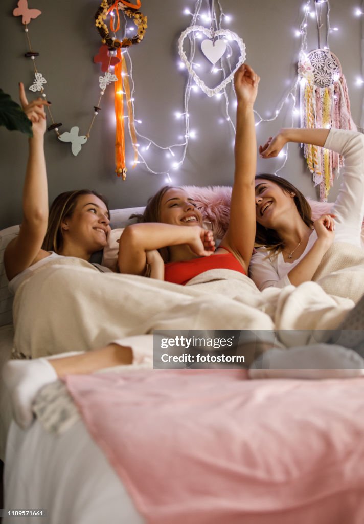 Girlfriends having fun on a sleepover