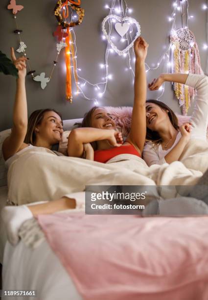 girlfriends having fun on a sleepover - college dorm party stock pictures, royalty-free photos & images