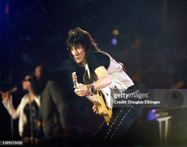 English Rock musician Ronnie Wood, of the group the Rolling Stones, plays guitar as he performs onstage during the group's 'Voodoo Lounge Tour' at...