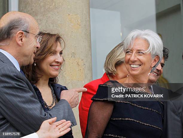 France's former Finance minister Christine Lagarde who was named the day before the first-ever female chief of the IMF, speaks with her colleagues,...