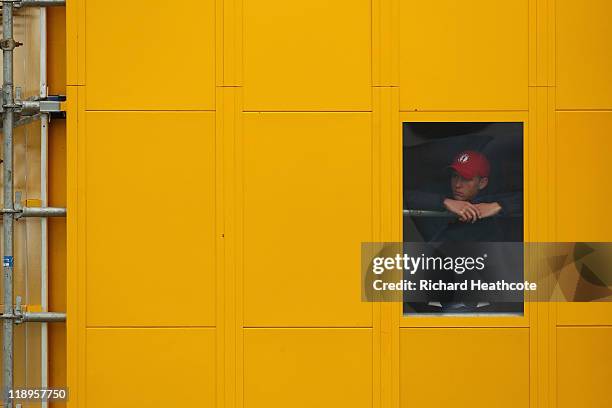 Scoreboard operator looks on during the final practice round during The Open Championship at Royal St. George's on July 13, 2011 in Sandwich,...