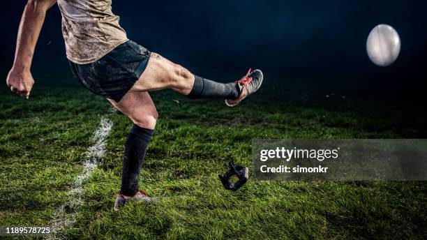 rugby player kicking ball - rugby ball kick stock pictures, royalty-free photos & images
