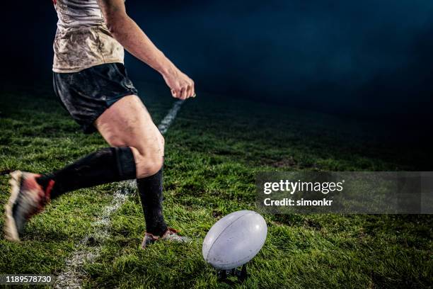 rugby player kicking ball - rugby ball kick stock pictures, royalty-free photos & images