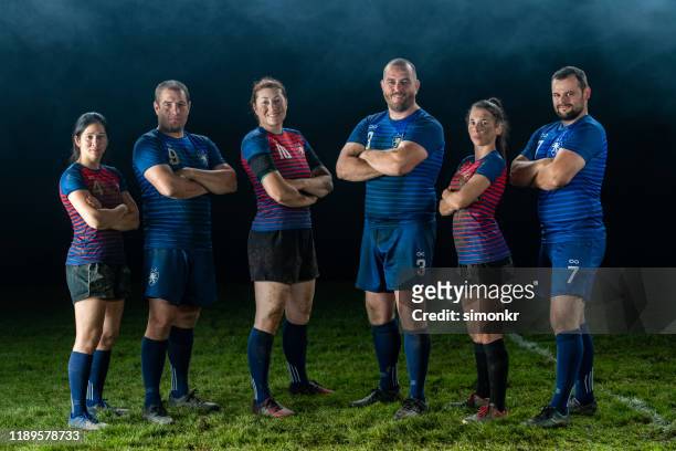 rugby players standing on field - women sports team stock pictures, royalty-free photos & images