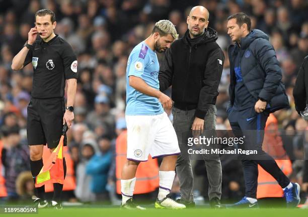 Pep Guardiola, Manager of Manchester City embraces Sergio Aguero of Manchester City during the Premier League match between Manchester City and...