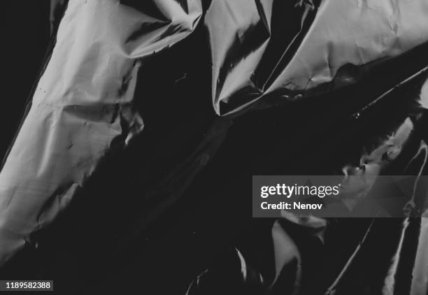 full frame shot of black plastic bag - nylon foto e immagini stock