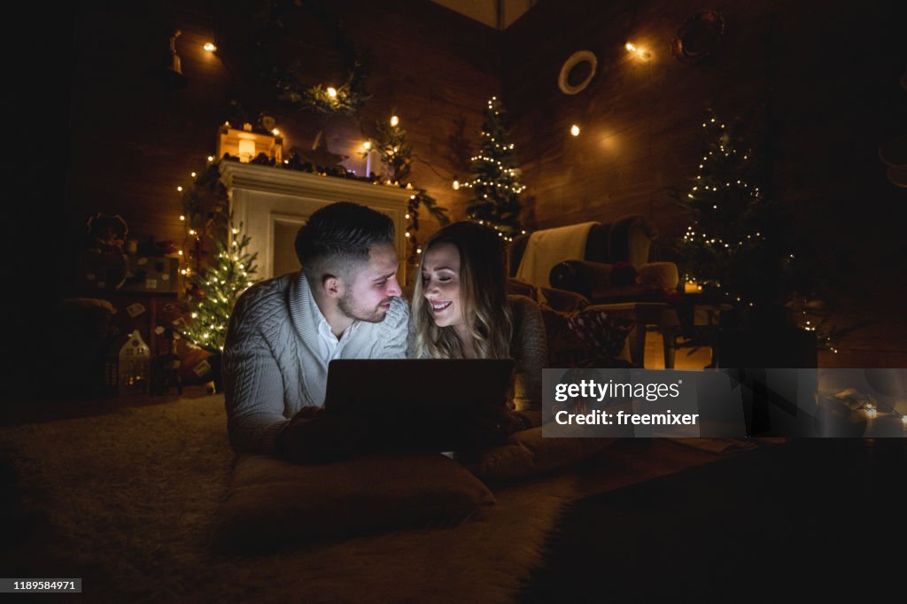 Young Couple Watching Movies On Christmas Eve HighRes Stock Photo Movies On Christmas Eve