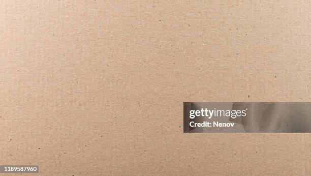 close-up of old brown paper texture background - card board stock-fotos und bilder