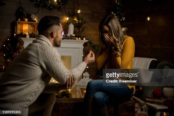 proposal is my christmas gift to you - man proposing indoor stock pictures, royalty-free photos & images