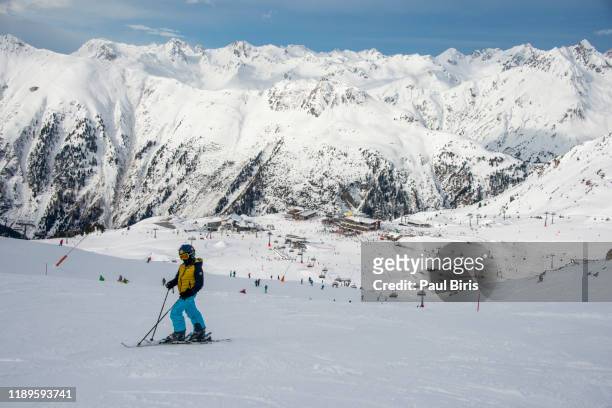 young skier enjoying the nature in mountains, ischgl silvretta arena ski resort, austria/switzerland - イシュグル ストックフォトと画像