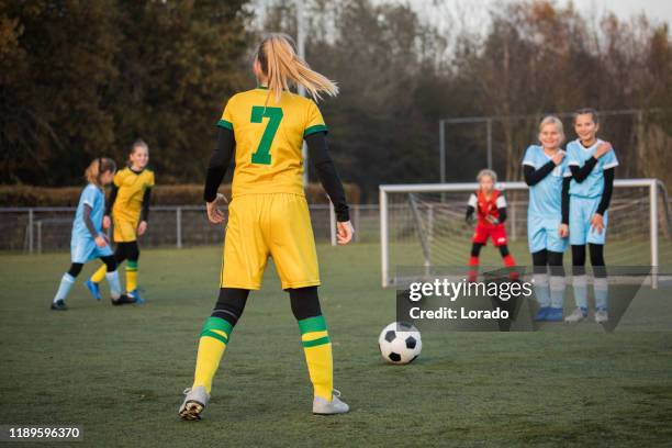 a girl taking a football free kick with a soccer ball - netherlands football team stock pictures, royalty-free photos & images