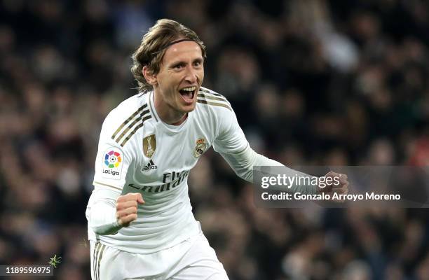 Luka Modric of Real Madrid celebrates after scoring his team's third goal during the La Liga match between Real Madrid CF and Real Sociedad at...