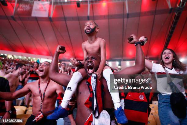 Fans of Flamengo celebrate their team's win after the Flamengo v River Plate Copa CONMEBOL Libertadores 2019 Final at Maracana Stadium on November...