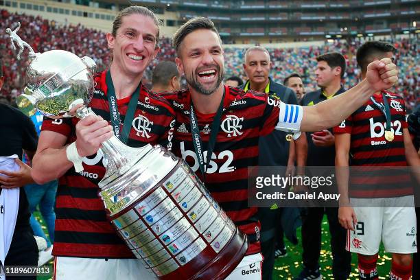 Filipe Luis and Diego of Flamengo pose with the Copa Libertadores trophy after the final match of Copa CONMEBOL Libertadores 2019 between Flamengo...
