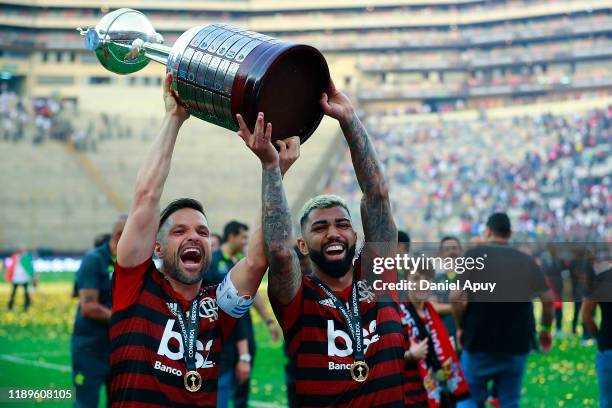 Diego and Gabriel Barbosa of Flamengo lift the trophy after winning the final match of Copa CONMEBOL Libertadores 2019 between Flamengo and River...