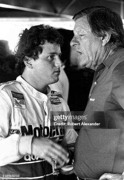 Driver Ricky Rudd, left, talks with his race car's owner, Bud Moore, in the Daytona International Speedway garage during a practice session for the...