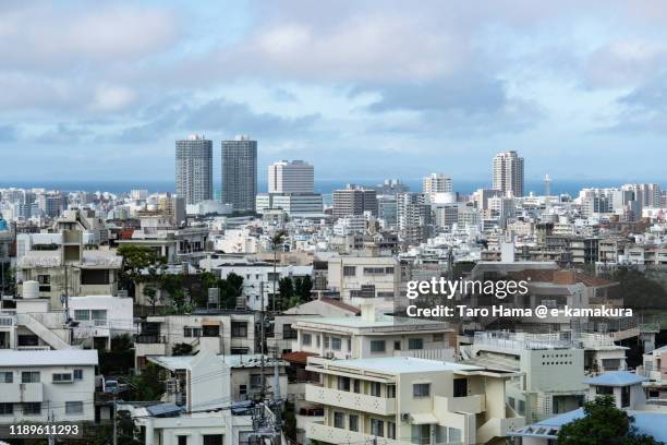 residential district in naha city in okinawa prefecture of japan - okinawa blue sky beach landscape stock-fotos und bilder