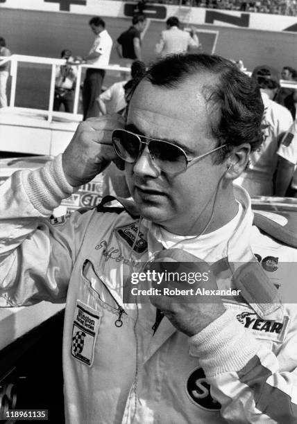 Driver Geoff Bodine prepares to enter his race car for the start of the 1983 Daytona 500 on February 20, 1983 at the Daytona International Speedway...