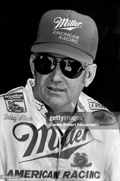 Driver Bobby Allison talks with reporters in the Daytona International Speedway garage prior to the start of the 1987 Daytona 500 on February 15,...