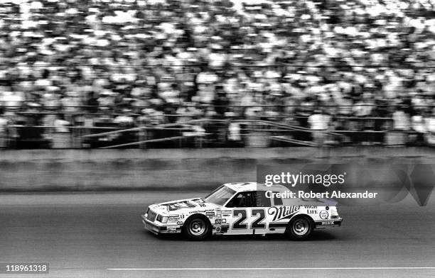 Driver Bobby Allison drives past the Daytona International Speedway grandstands during the 1987 Daytona 500 on February 15, 1987 in Daytona Beach,...